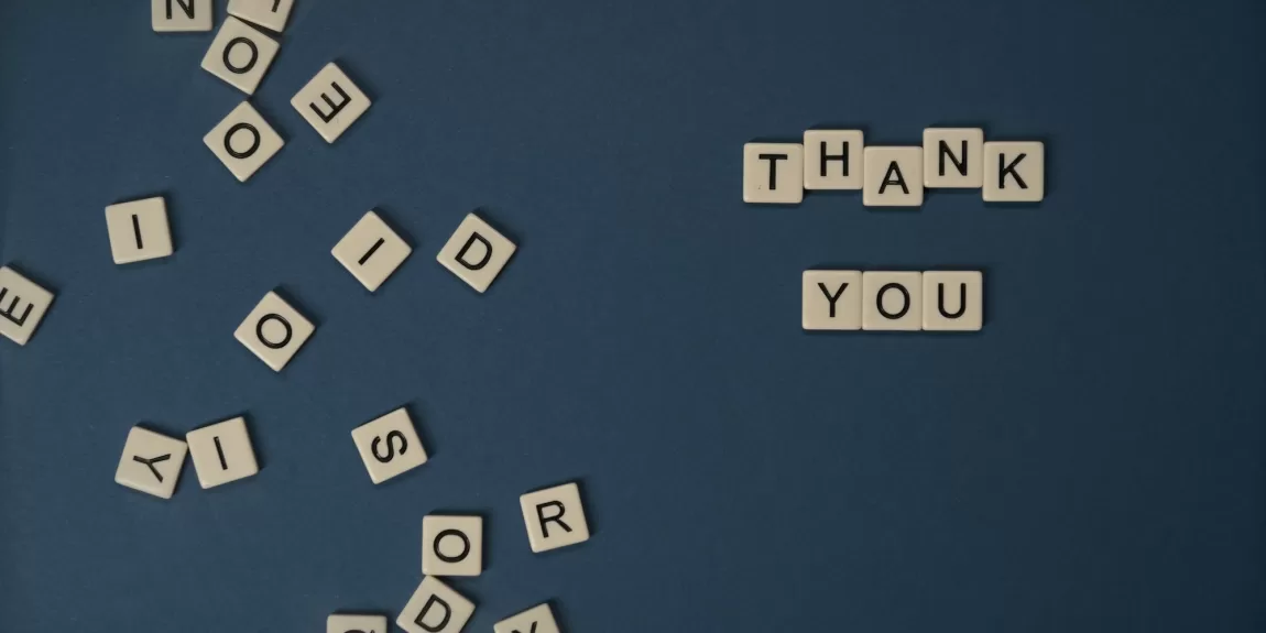 "thank you" spelled out with letter tiles